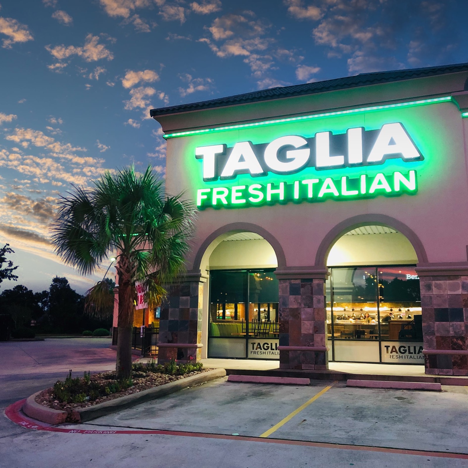 Taglia Fresh Italian storefront sign at sunset