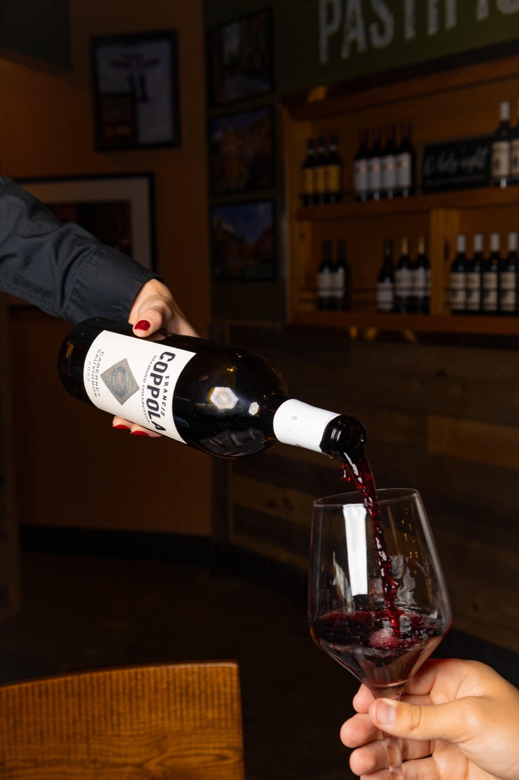 Red wine being poured into a wine glass